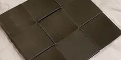 A dark brown interwoven mat