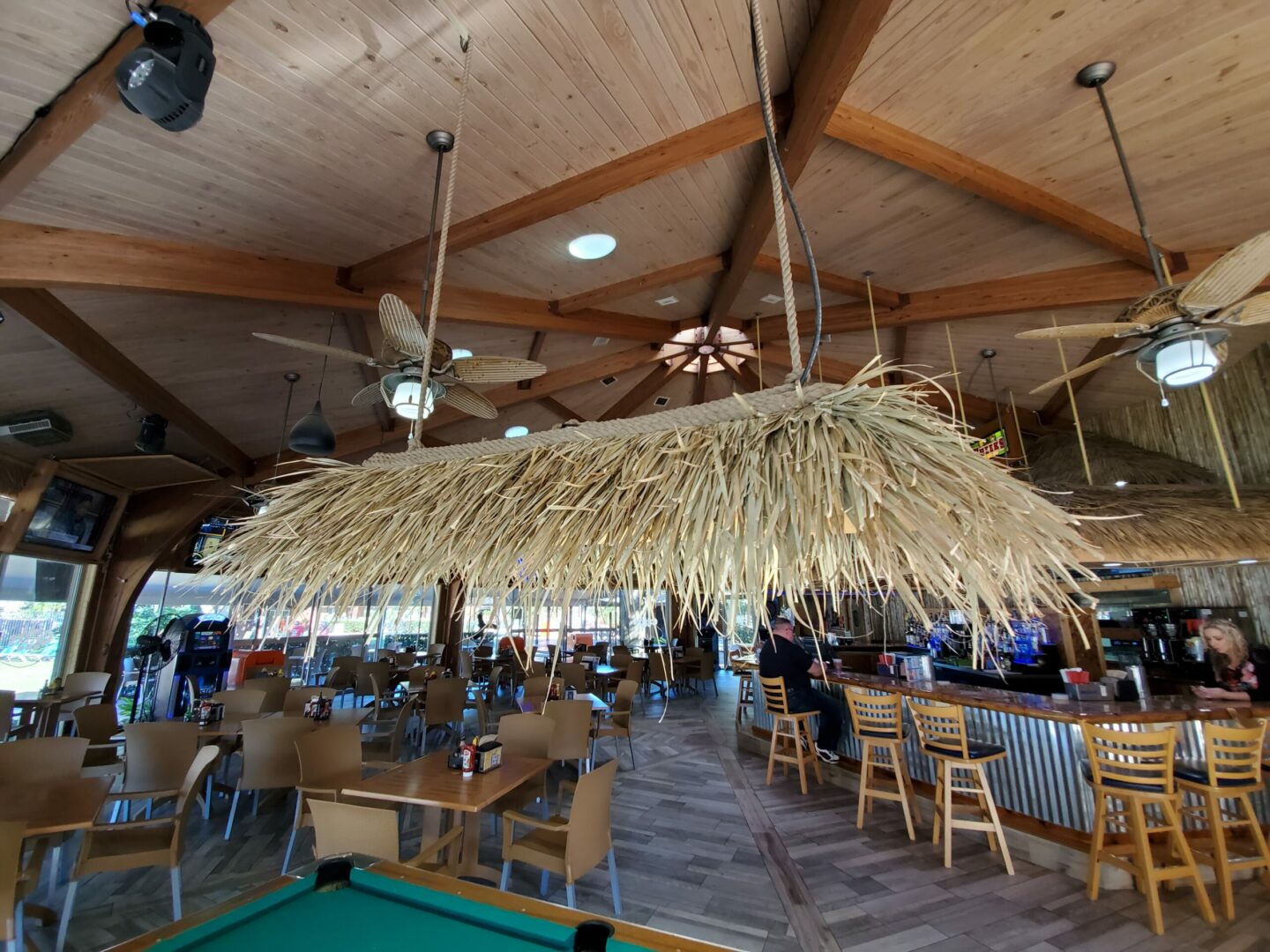 The ceiling of a restaurant with a tiki bar.