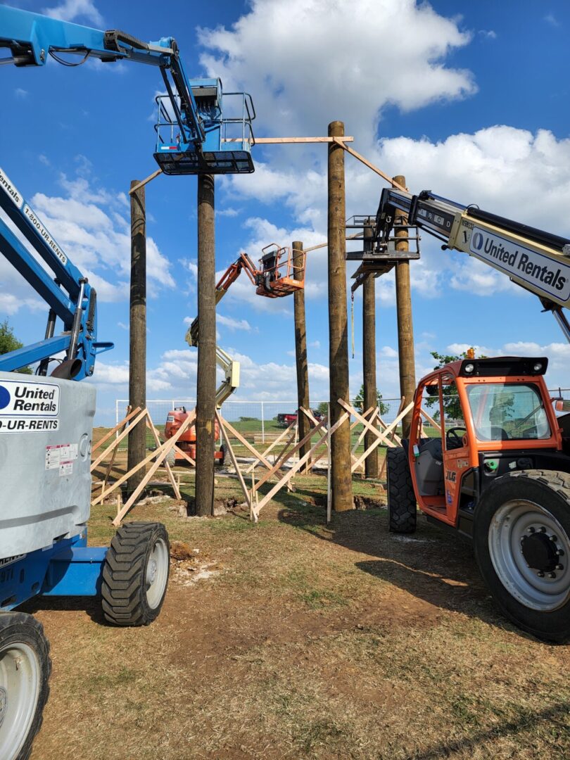 Tiki King using lift platforms to construct an enormous tiki hut