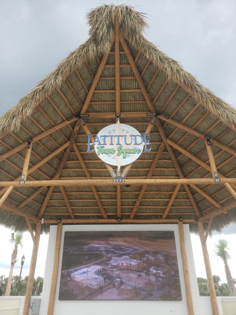 A gazebo with a large screen on it.