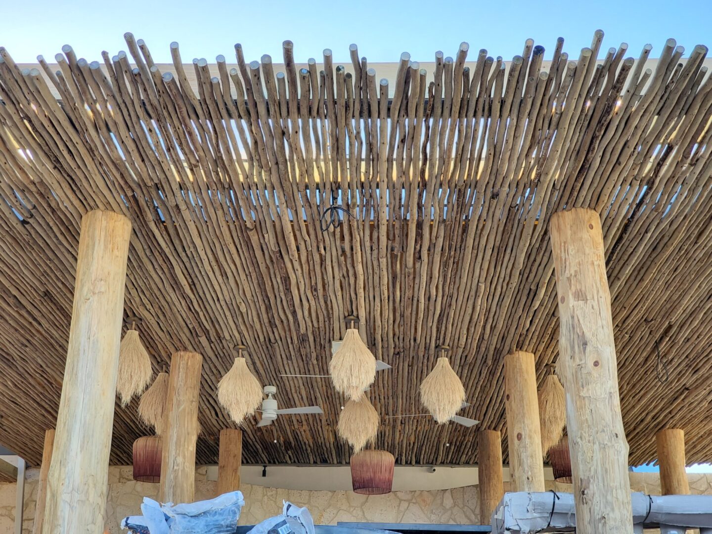 The roof of a restaurant is made of bamboo sticks.