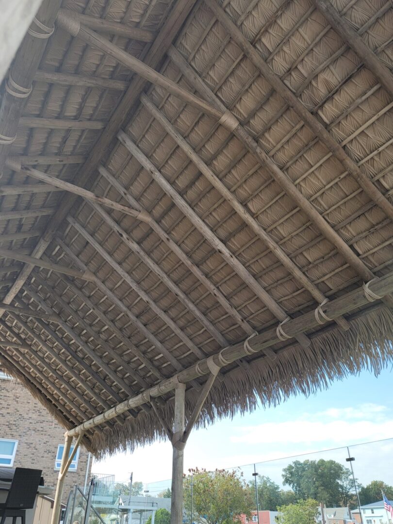 A patio with a thatched roof.