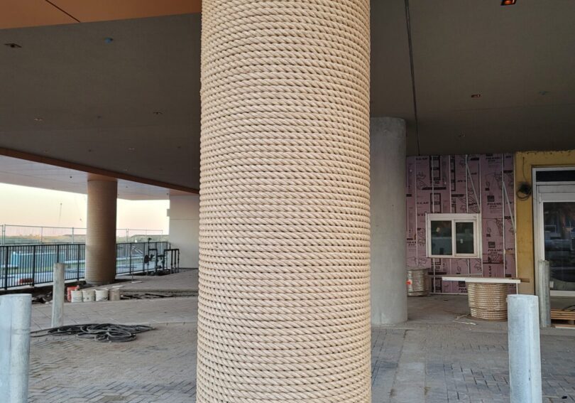 A pillar with a rope wrapped around it.