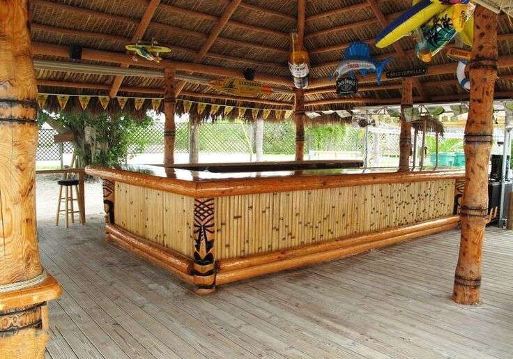 A tiki bar on a wooden deck.